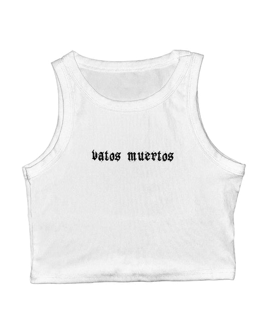 White crop tank top with the text 'vatos muertos' printed in black on the front.